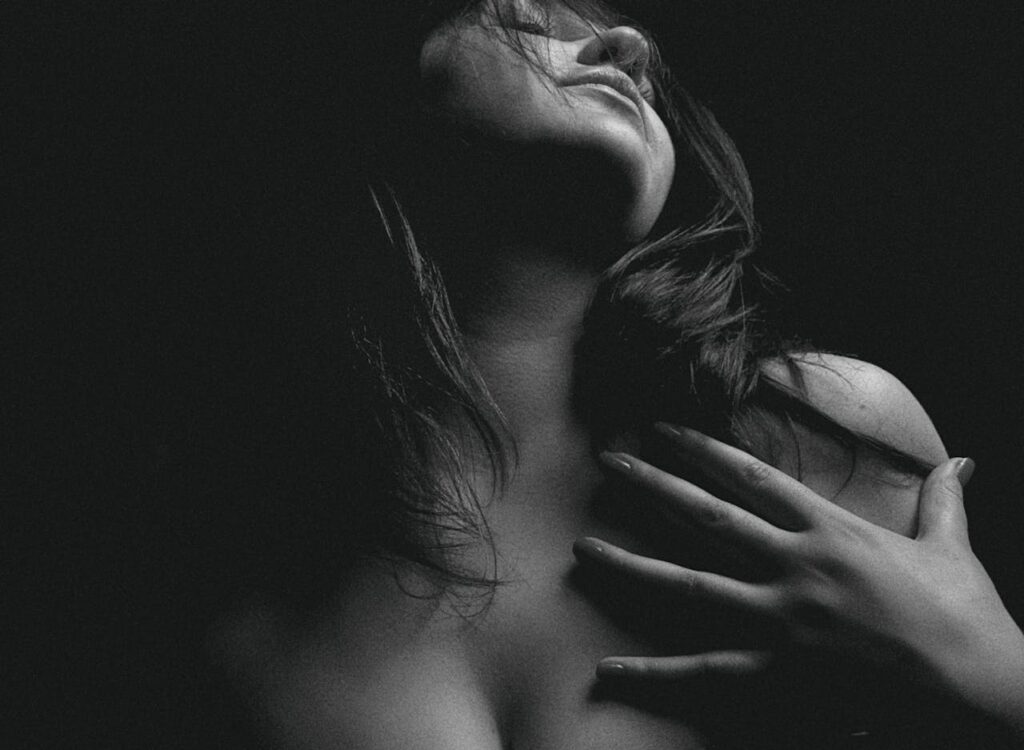 Claire A captivating and sensual black and white portrait of a woman in a moody setting.